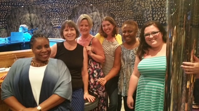 Freddie with a group of women friends gathered together
